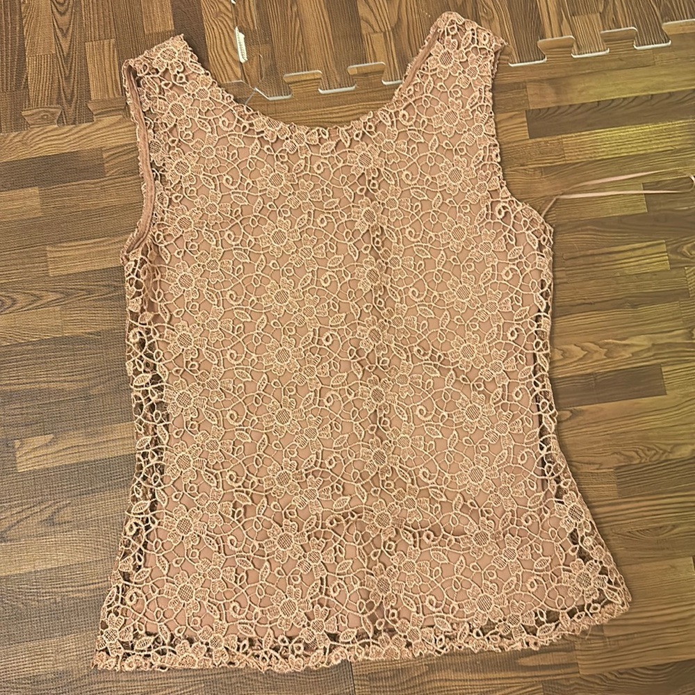 Pink in color and size 32 and the brand is Emily Moon